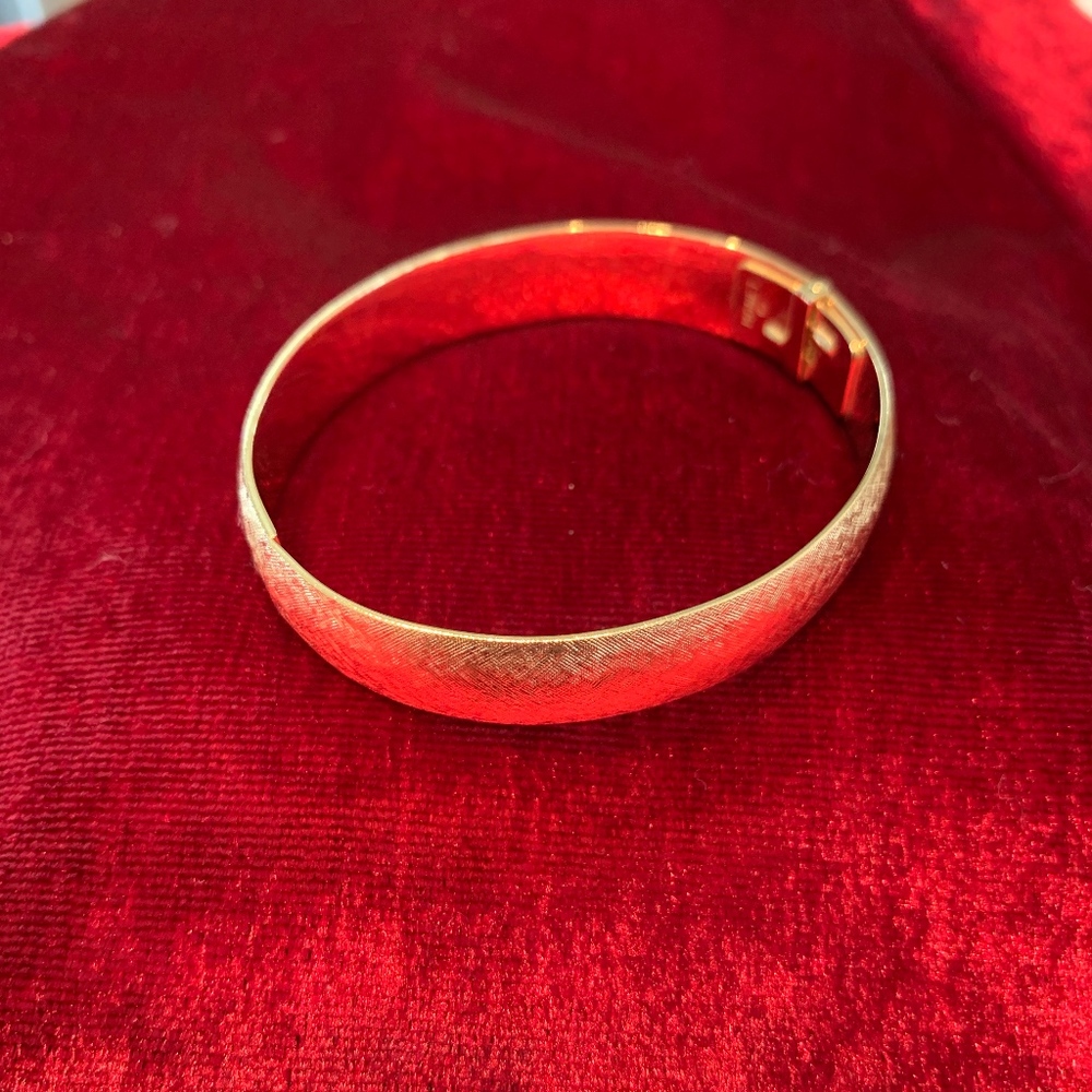 Gold Tone Monet bangle bracelet, 2.25in diameter